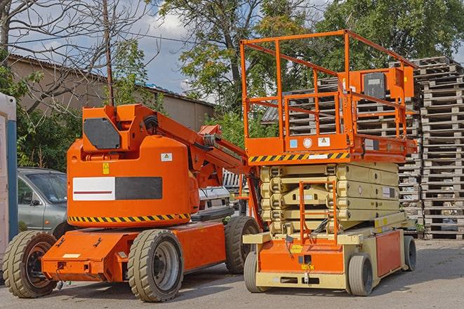 forklift driver organizing inventory in warehouse in Auxvasse